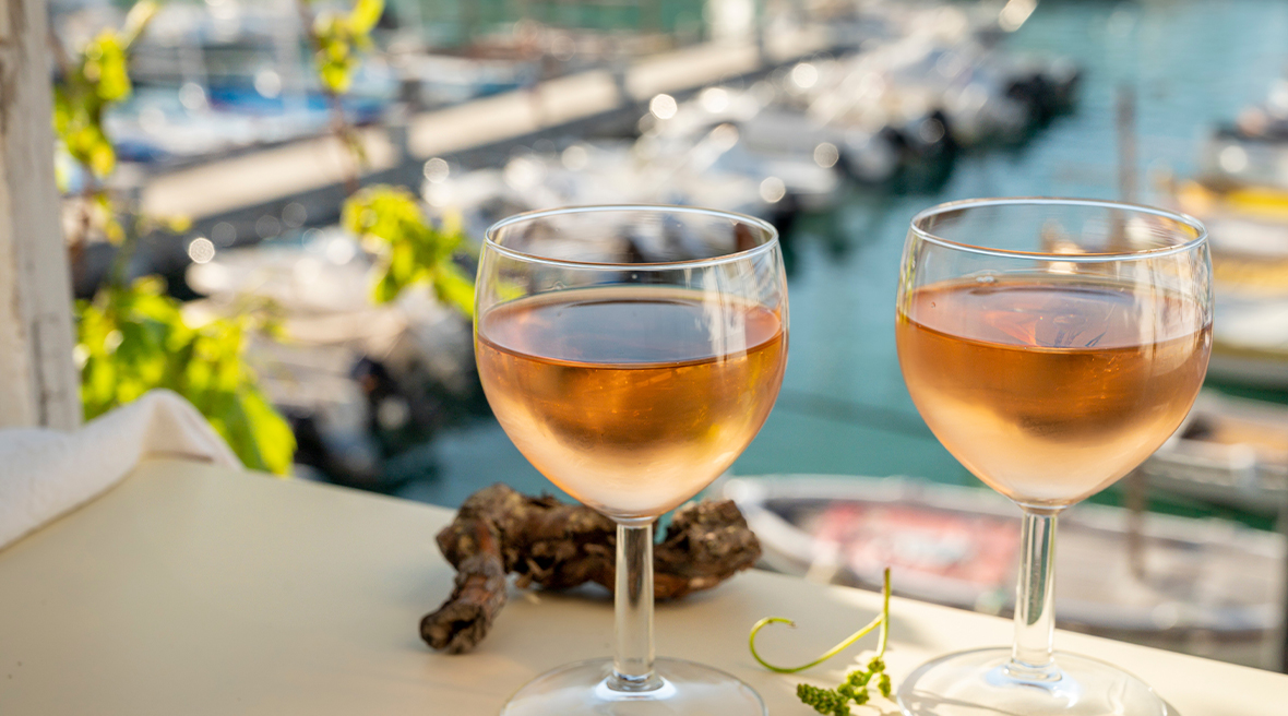 Cold rose wine in glasses served on outdoor terrace
